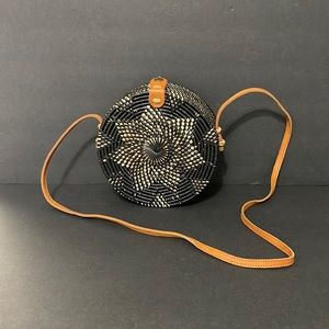 BLACK AND TAN ROUND RATTAN PURSE